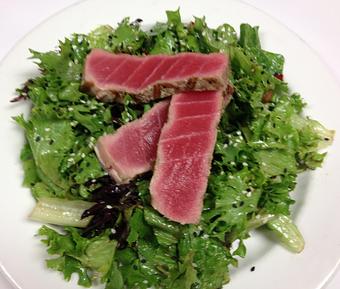 Product: Sliced Ahi Tuna on Mixed Greens Dressed with Sesame Vinaigrette, Sprinkled with Sesame Seeds - The Caboose Restaurant in Located in Beautiful Downtown McComb - McComb, MS Cajun & Creole Restaurant