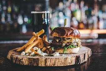 Product: 3D Valley beef, arugula, caramelized onion, mushroom, gorgonzola, pretzel roll - The Exchange Pub + Kitchen in New Albany, IN American Restaurants