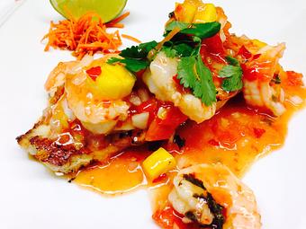 Product: This plate is actually a grouper filet instead of Mahi. Topping is Shrimp sautéed mango sauce - The Fish House in Miami, FL Seafood Restaurants