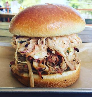 Product: Pulled Pork Sandwich with Comeback Coleslaw - The Pig & Pint in Historic Fondren - Jackson, MS Barbecue Restaurants