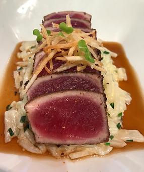 Product: Porcini Dusted Sashimi Grade Yellowfin Tuna with 'Potato' Risotto and Porcini-Dashi Broth - The Plaza Café in Southampton Village - Southampton, NY American Restaurants