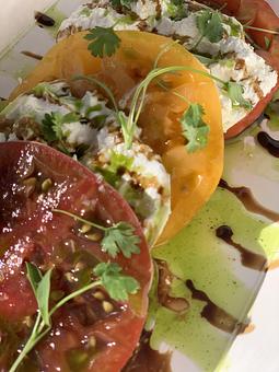 Product: domestic burrata, heirloom tomatoes, micro basil, aged balsamic, basil oil - The Plaza Café in Southampton Village - Southampton, NY American Restaurants