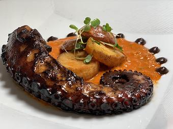 Product: black garlic glaze, romesco sauce, 'patatas bravas' - The Plaza Café in Southampton Village - Southampton, NY American Restaurants