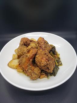 Product: fried chicken leg, wing & thigh with collard greens & confit red potatoes - The Pressed Penny Tavern in Kansas City, MO American Restaurants