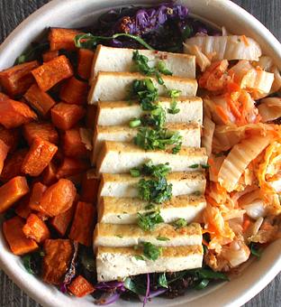 Product: Sauteed garnet quinoa, collard topped w/ choice of kimchi or sauerkraut. roasted tofu, crsipy roasted sweet potato. - The Pureganic Cafe in Downtown Rye - Harrison, NY Jewish & Kosher Restaurant