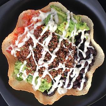 Product: Our crispy gluten free taco bowl filled with romaine lettuce, red quinoa, pico de gallo, guacamole, avocado & black beans and topped with our special dressing. - The Pureganic Cafe in Downtown Rye - Harrison, NY Jewish & Kosher Restaurant