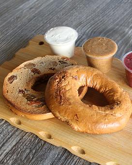 Product: Freshly baked yummy GF bagel with cashew cream cheese or strawberry chia jam. - The Pureganic Cafe in Downtown Rye - Harrison, NY Jewish & Kosher Restaurant