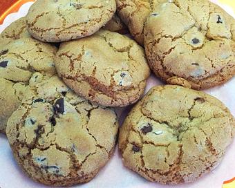 Product: Our perfectly soft chocolate chip cookies baked to a golden brown delicious, made with fresh dairy butter, real vanilla and Guittard Choclate chips. - The Village Bakery in Houston, TX Bakeries