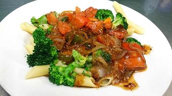 Product: One of our NEW delicious VEGAN dishes! Sauteed tomatoes, onions, mushrooms, & steamed broccoli, seasoned with a touch of rosemary & tossed in our caramelized golden italian, topping tender penne pasta. - The White Possum Grille in Smithville, TN American Restaurants