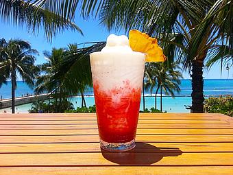 Product: Bacardi Black rum tops this pineapple-coconut blended drink with Trader Vic's dark rum, strawberry & mango puree. Our ultra-premium Lava Flow! - Tikis Grill & Bar in Waikiki - Honolulu, HI Bars & Grills