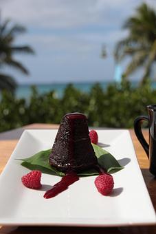 Product: Molten macadamia nut butter, raspberry coulis - Tikis Grill & Bar in Waikiki - Honolulu, HI Bars & Grills