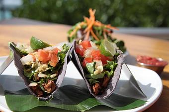 Product: Pan-seared fresh island catch, Kula onion, guacamole, sour cream, shredded lettuce, diced Hau'ula tomatoes & onions in blue corn tortillas. Served with salsa - Tikis Grill & Bar in Waikiki - Honolulu, HI Bars & Grills