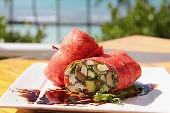 Product: Fresh mozzarella, vine-ripened​ Hau'ula tomatoes, Nalo basil pesto, capers, Kula onions, avocado & grilled Portobello mushroom slices all wrapped up in a sundried tomato flour tortilla. Served with locals Dean's Greens
vegetarian - Tikis Grill & Bar in Waikiki - Honolulu, HI Bars & Grills