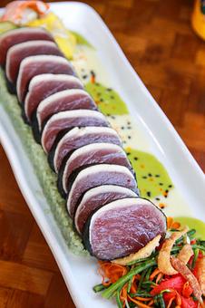 Product: Nori Wrapped ʻAhi* Seared fresh caught ʻahi tuna, white shoyu- wasabi sauce, mango namasu, bamboo rice. - Tikis Grill & Bar in Waikiki - Honolulu, HI Bars & Grills