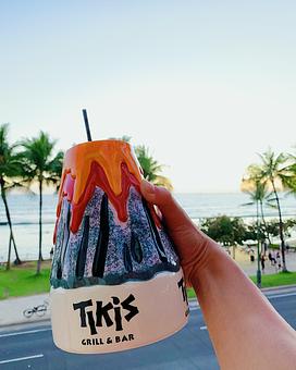 Product: Tito's Handmade Vodka, Sailor Jerry Rum, Kraken rum, coconut cream & pineapple. - Tikis Grill & Bar in Waikiki - Honolulu, HI Bars & Grills