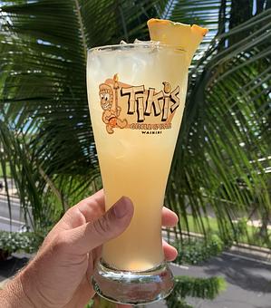 Product: 20oz Pilsner glass with a mix of Skyy Pineapple Vodka, Watermelon, Peach and Orange liqueurs top with Pineapple juice. You get to take the glass home. - Tikis Grill & Bar in Waikiki - Honolulu, HI Bars & Grills