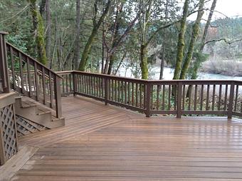 Product: Composite deck with wooden railing By Tim Hubbard Construction of Southern Oregon - Tim Hubbard Construction in Wilderville, OR Builders & Contractors