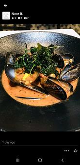 Product: Steamed with red wine sauce. - Tomahawk Steak, Chops, and Seafood in San Ramon, CA American Restaurants