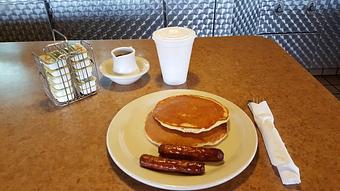 Product: two small pancakes with choice of bacon or sausage - Tommy's Restaurant in Grand Island, NE Sandwich Shop Restaurants