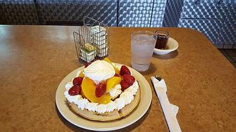 Product: waffle with peaches and strawberries - Tommy's Restaurant in Grand Island, NE Sandwich Shop Restaurants