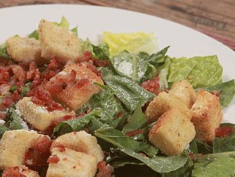 Product: All hail the Caesar salad. Featuring all of the quality ingredients  you’d expect in this Townies favorite, including crisp Lettuce,  creamy Caesar dressing, herbed croutons and grated Parmesan cheese and tossed for your enjoyment. - Townies Pizzeria in Fernandina Beach, FL Italian Restaurants