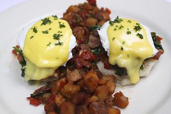 Product: Biscuits topped with Poached Eggs and Hollandaise alongside Home Fries or Hash Browns - Virginia's On King in Historic Downtown Charleston - Charleston, SC American Restaurants