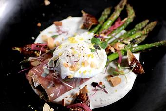 Product: charred + chilled asparagus, prosciutto, dill + lemon greek yogurt, balsamic roasted figs, pickled red onions, poached egg on top, crushed almonds (GF) - Washington Prime in South Norwalk, CT American Restaurants