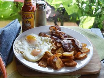 Product: American Breakfast - Two Eggs your way, sausage or bacon, fried potatoes, and toast - West Allis Cheese & Sausage Shoppe in West Allis, WI Coffee, Espresso & Tea House Restaurants