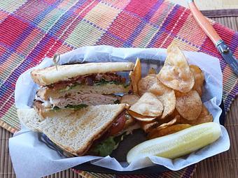 Product: Nueske's Clubhouse - BLT with Turkey between three layers of bread - West Allis Cheese & Sausage Shoppe in West Allis, WI Coffee, Espresso & Tea House Restaurants