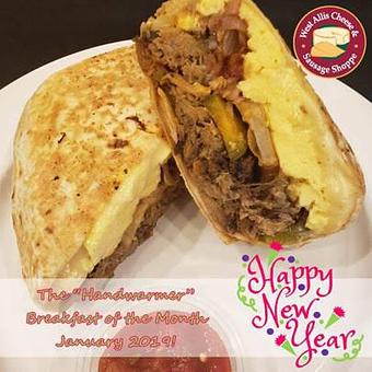 Product: The Handwarmer Burrito - pulled pork, ghost pepper jack, pickled red onion, potatoes, house chipotle sauce, scrambled eggs and jalapenos wrapped in a flour tortilla - West Allis Cheese & Sausage Shoppe in West Allis, WI Coffee, Espresso & Tea House Restaurants