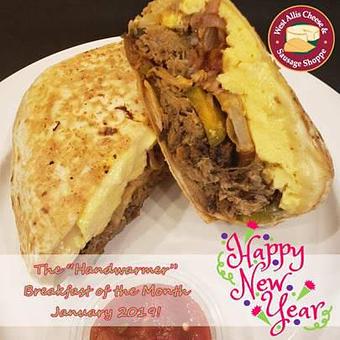 Product: The Handwarmer Burrito - pulled pork, ghost pepper jack, pickled red onion, potatoes, house chipotle sauce, scrambled eggs and jalapenos wrapped in a flour tortilla - West Allis Cheese & Sausage Shoppe in Milwaukee, WI Meat Products