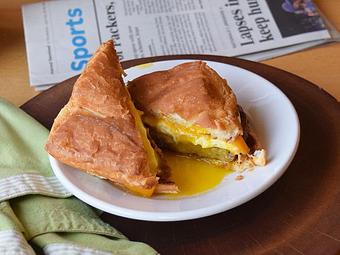Product: Breakfast Sandwich - eggs your way, sausage, bacon, or ham, cheddar, on croissant - West Allis Cheese & Sausage Shoppe in Milwaukee, WI Meat Products