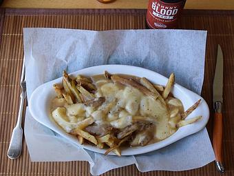 Product: Poutine - french fries topped with cheese curds and gravy - West Allis Cheese & Sausage Shoppe in Milwaukee, WI Meat Products