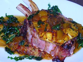 Product: Bacon wrapped double Pork Chop with peach gravy - Woody's Tupelo in Tupelo, MS Hamburger Restaurants