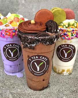 Product: Left: Taro Smoothies with Upgraded Cup, House Rainbow Fruit Balls and Macaron. Center: Oreo Blended with Upgraded Cup, Cupcake and Macaron. Right: Pina Colada Smoothie with Upgraded Cup, Flower Cupcake, 2 Macarons - Y Tea Cafe in Garden Grove, CA Sandwich Shop Restaurants