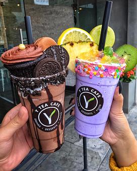 Product: Left: Oreo Cookie Blended with Upgraded Cup, Cupcake and Macaron. Right: Taro Smoothies with Upgraded Cup, House Rainbow Fruit Balls and Macaron - Y Tea Cafe in Garden Grove, CA Sandwich Shop Restaurants