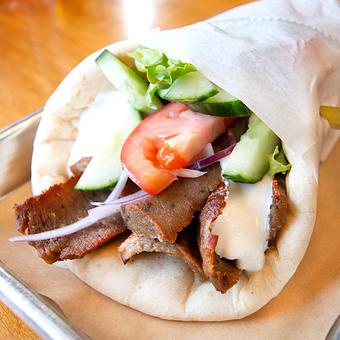 Product: Beef gyro sandwich with lettuce, tomato, onion, lettuce and yogurt sauce. - Zendiggi Kebab House in Closter, NJ Middle Eastern Restaurants