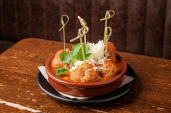 Product: Five meatballs in sauce topped with shredded cheese, served in sauce in a light blue bowl on top of a Cafe Ba-Ba-Reeba! menu - Lil’ Ba-Ba-Reeba! in River North - Chicago, IL Bars & Grills