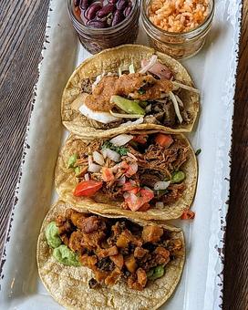 Product: Choice of (3) Smoked Chicken, Pulled Pork, Brisket, Fish, and Veggie. Corn or Flour Tortillas. Addition of Rice and Beans. - Longtable Beer Cafe in Downtown Middleton - Middleton, WI American Restaurants