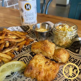Product: Cornmeal and rice flour crusted Alaskan Cod served with frites, coleslaw, tartar sauce and lemon. - Longtable Beer Cafe in Downtown Middleton - Middleton, WI American Restaurants