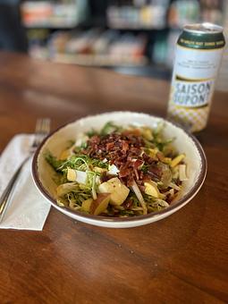 Product: Frisée, grilled endive, crumbled egg, diced apple, sliced almond, warm Nueske’s bacon, and apple cider vinaigrette - Longtable Beer Cafe in Downtown Middleton - Middleton, WI American Restaurants