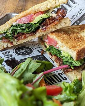Product: Nueske’s bacon, Vitruvian Farms spinach, Don’s Produce heirloom tomato, avocado, chipotle aioli on Madison Sourdough bread - Longtable Beer Cafe in Downtown Middleton - Middleton, WI American Restaurants