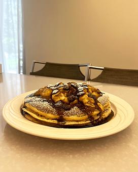 Interior: Short Stack of Pancakes with Bananas Foster Topping - M.a.c. 24/7 in Waikiki - Honolulu, HI American Restaurants