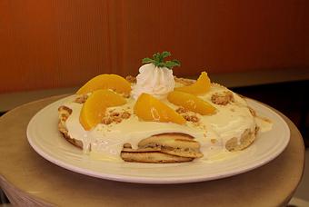 Product: Short Stack of Pancakes with Peaches & Cream Topping - M.a.c. 24/7 in Waikiki - Honolulu, HI American Restaurants