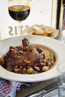 Product: Chicken braised in red wine with bacon lardons, pearl onions, and mushrooms. - 39 Rue de Jean in Historic Downtown Charleston - Charleston, SC French Restaurants