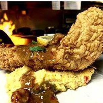 Product: Grouper Louisiana Served over Jalapeno Cheese Grits. Topped with Crawfish Etoufee - 440 Main in Bowling Green, KY Bars & Grills