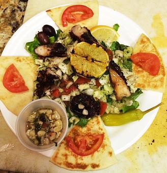 Product: A favorite dish. If you love calamari, you'll love grilled octopus. - Aladdin Mediterranean Grill in Home Depot Shopping Center - Palm Beach Gdns, FL Greek Restaurants