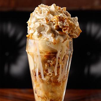 Product: Tara Glick's signature Crackerjack Sundae complete with popcorn and caramel drizzle. - American Cut Steakhouse Tribeca in TriBeca - New York, NY American Restaurants
