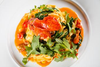 Product: Hand-made pasta ribbons, Maine lobster, chili flakes, cherry tomatoes, 
hand-torn bread crumbs, arugula - Angelina’s Ristorante in Bonita Springs, FL Italian Restaurants