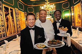 Product: Long time waiter Sterling Constant, Executive Chef Michael Regua, and long time waiter Rudy, in the Rex Room, one of the many private dining rooms. - Antoine's Restaurant in French Quarter - New Orleans, LA Cajun & Creole Restaurant
